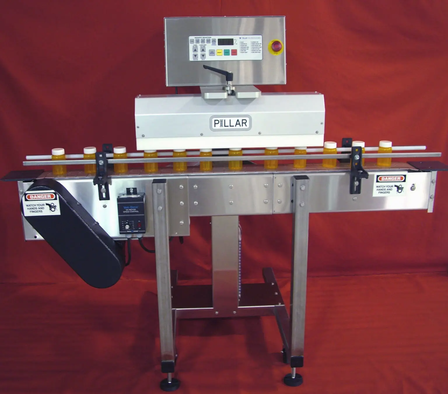 Conveyorised induction cap sealer