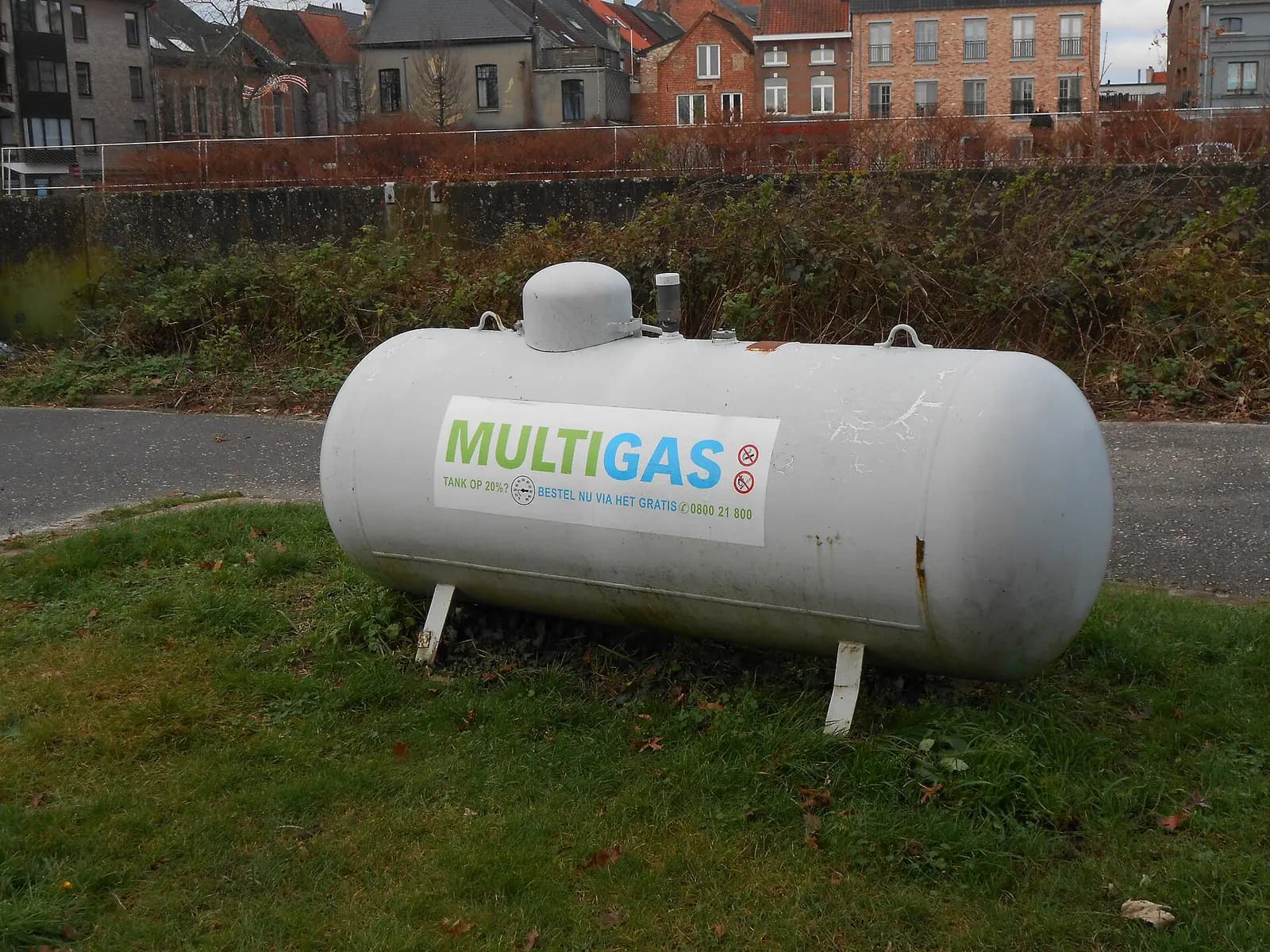 Horizontal LPG bullet storage tank, showing the white cylindrical pressure vessel with domed valve cover on support legs