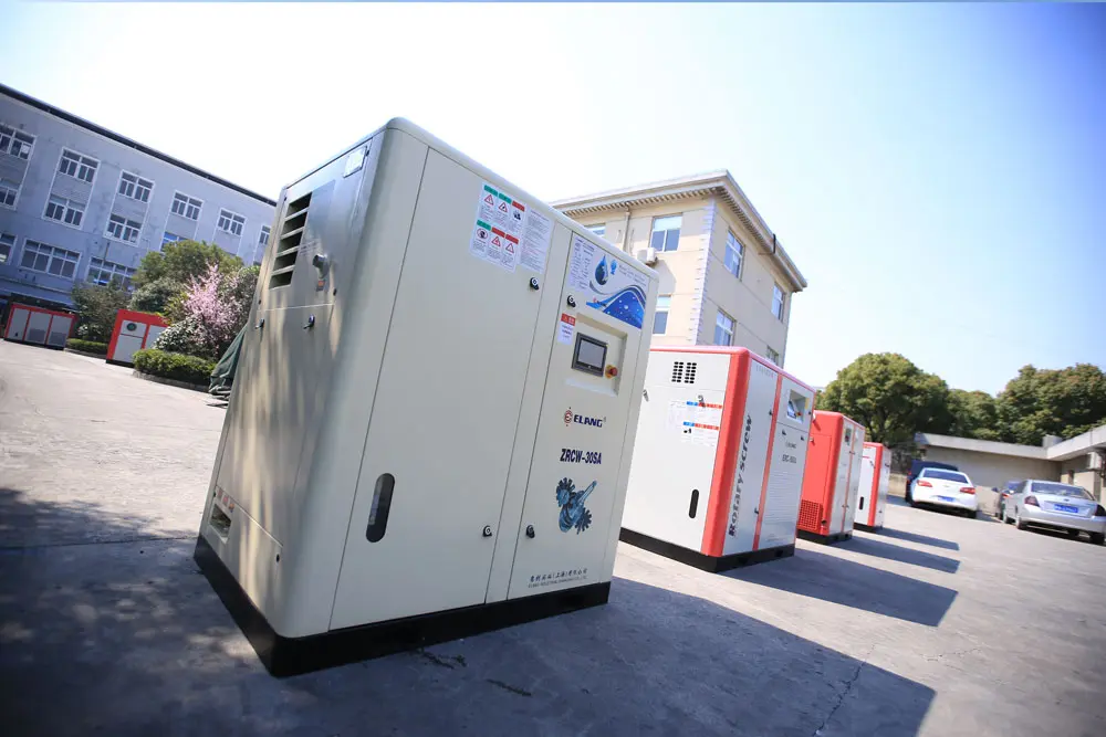 Rotary screw air compressor, enclosed cabinet-type industrial screw compressors with control panels lined up outdoors